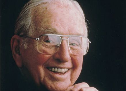 A portrait of Norman Vincent Peale outdoors.