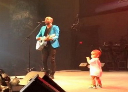 Singer, Coffey Anderson, is joined on stage by his toddler son.