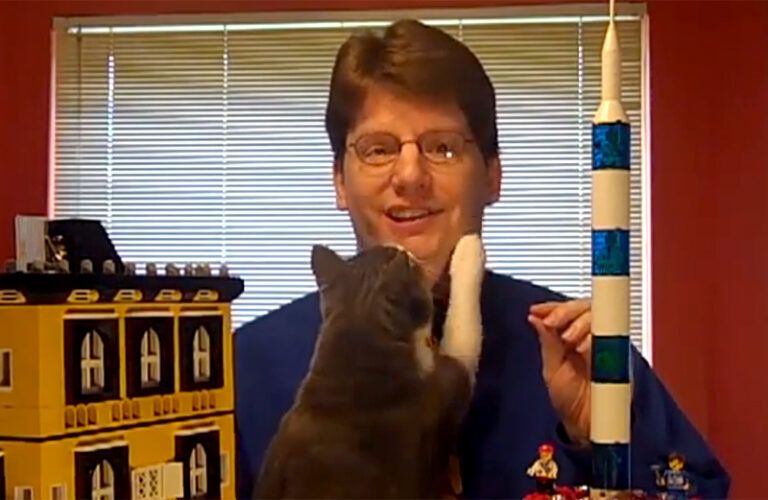 A cat interrupts a videotaping.