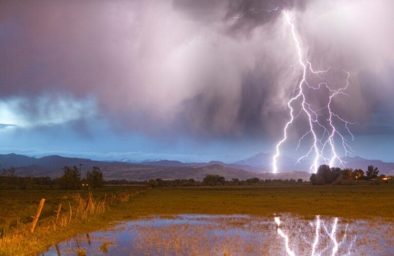 a bolt of lightning against a beautiful stormy sky