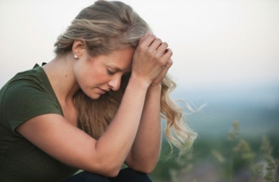 close-up of a woman in deep prayer