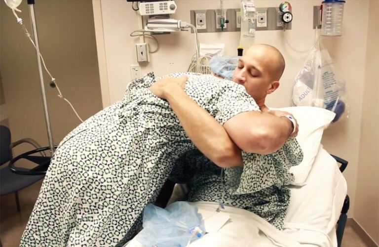 Octavian Maianu (left) hugs Ryan Crecco before the transplant surgery.