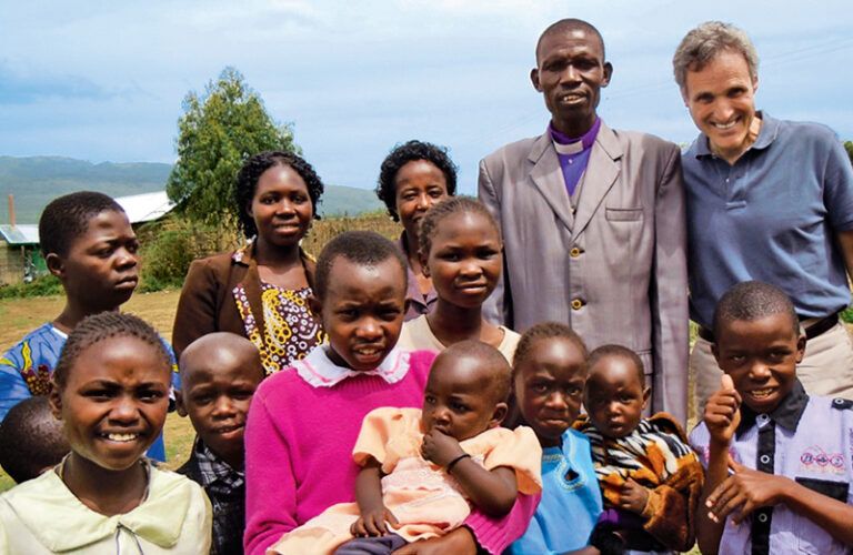 Rick Hamlin with Pastor Cornelious and some of his church congregants in Kenya