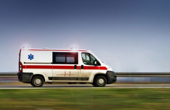 Ambulance speeding down the road