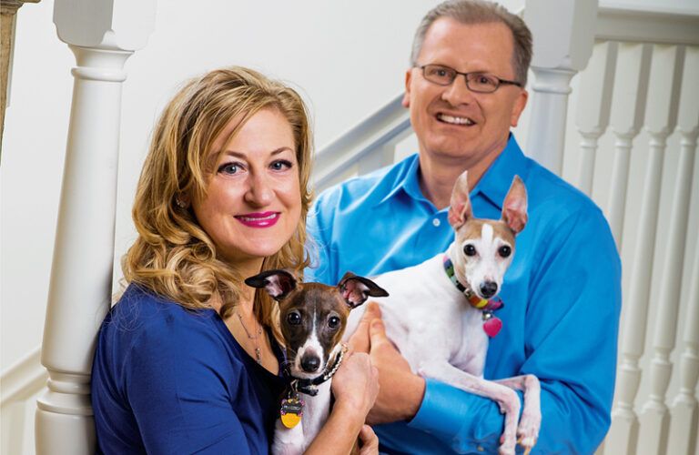 The Carlsons and their current pack, Francesca (left) and Leo