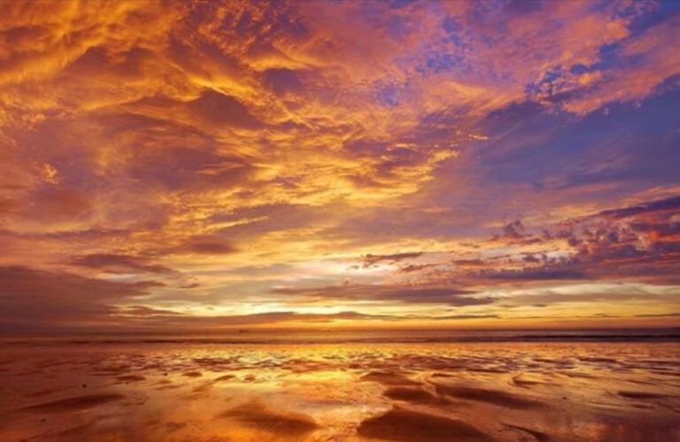 A gorgeous shot of a cloud filled sky at sunrise