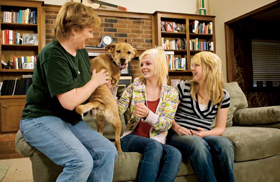 Faith the dog with her family