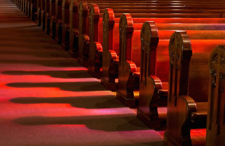 Empty church pews. Photo by Michael Warwick, Shutterstock.