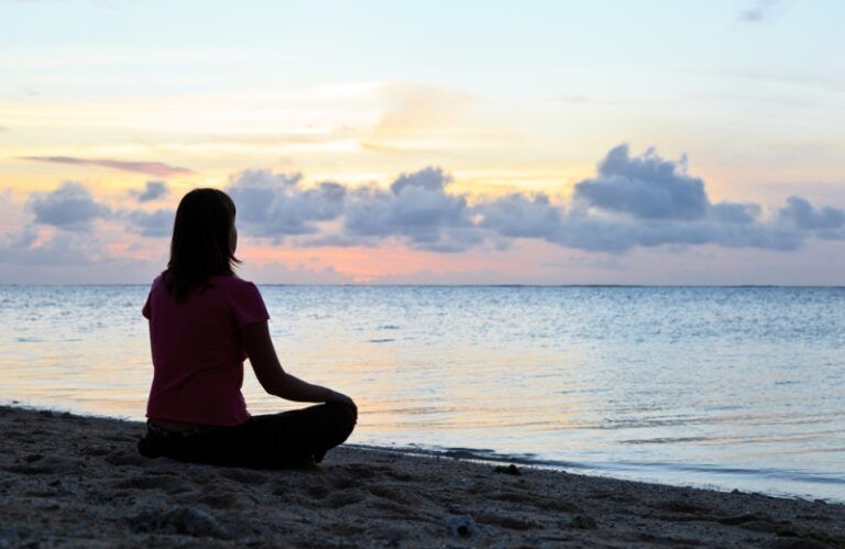 Woman praying. Shutterstock