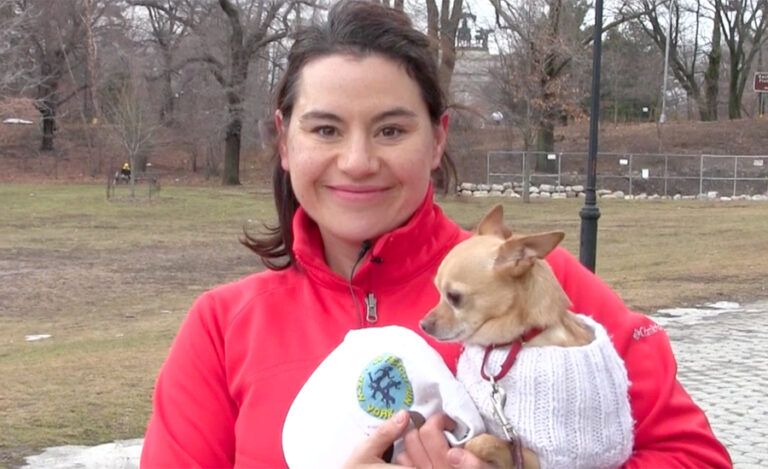 Go Fetch Run instructor Angie holding her dog