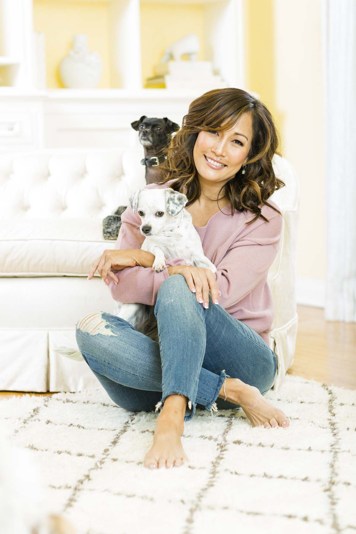 Carrie Ann spends some quality time with pooches Lola (in her lap) and Peanut looking over her shoulder