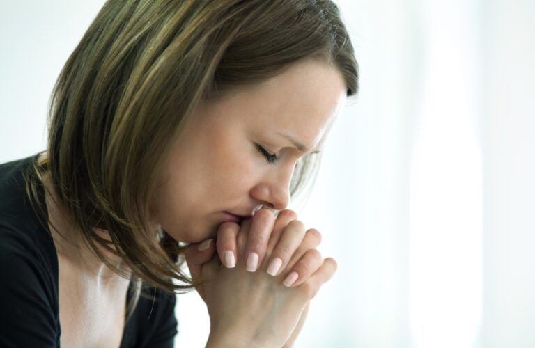 close-up of a woman praying