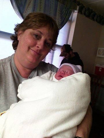 A grandmother holding her granddaughter. Photo courtesy Maggie Elaine Smith.