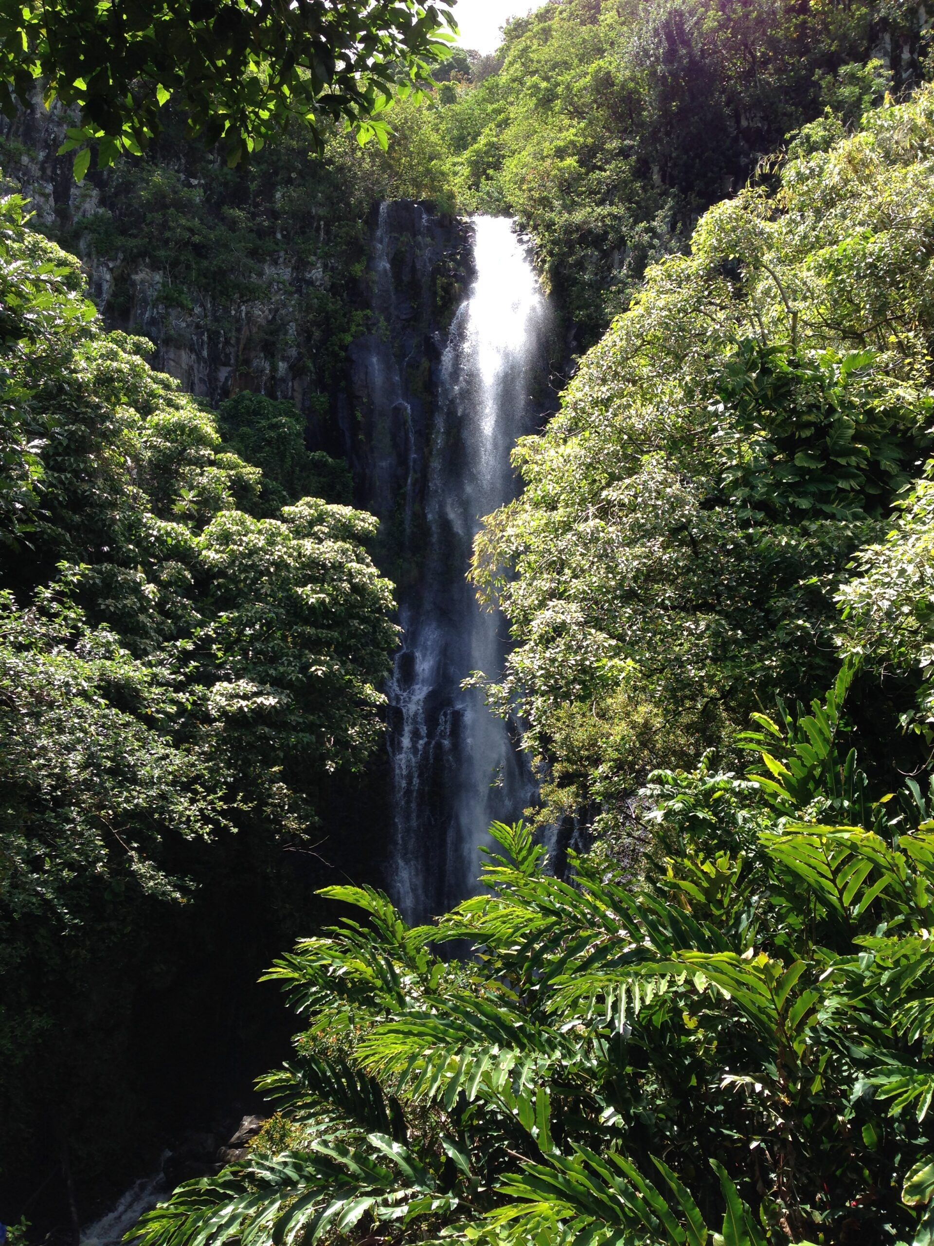 A waterfall along the road that leads to the town of Hana on the island of Maui, Hawaii.