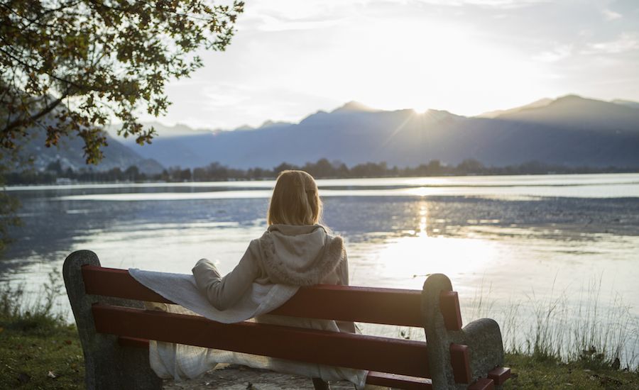 Woman contemplating nature, making time for God.