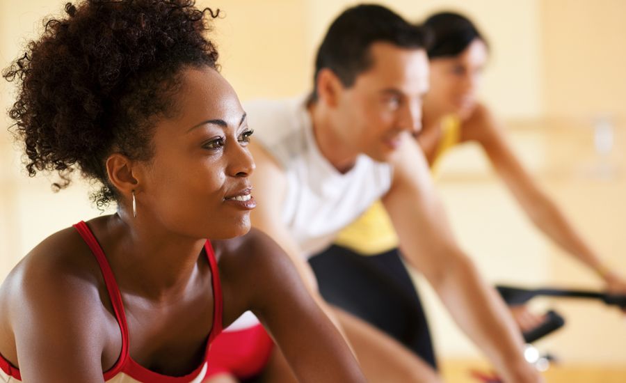 diverse group working out at a gym