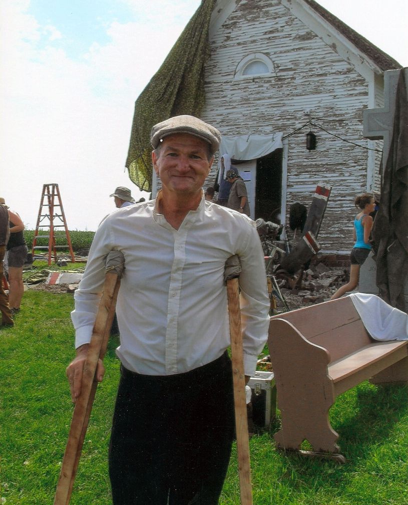 Greg poses in the front of the church early in the restoration process.