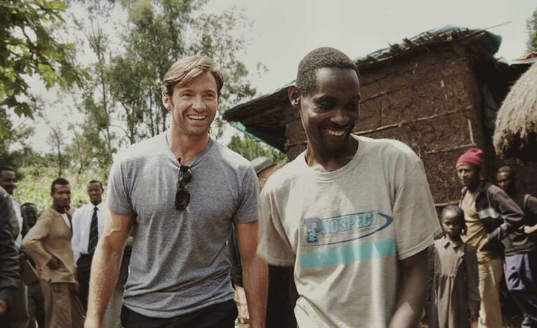 Hugh Jackman walking with Ethiopian coffee farmer Dukale