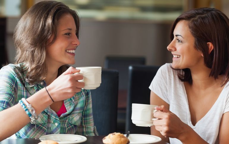 Two friends share some quality time over coffee.