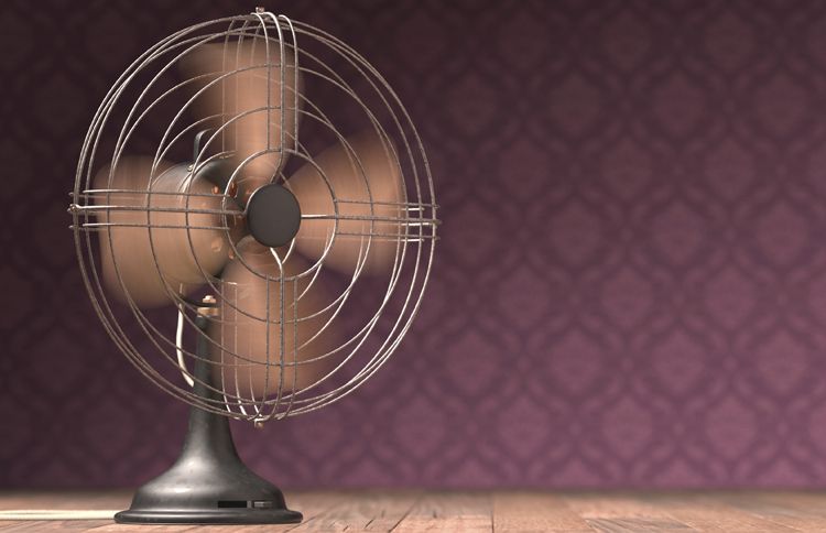 A vintage fan stirring up a breeze at Grandma's house