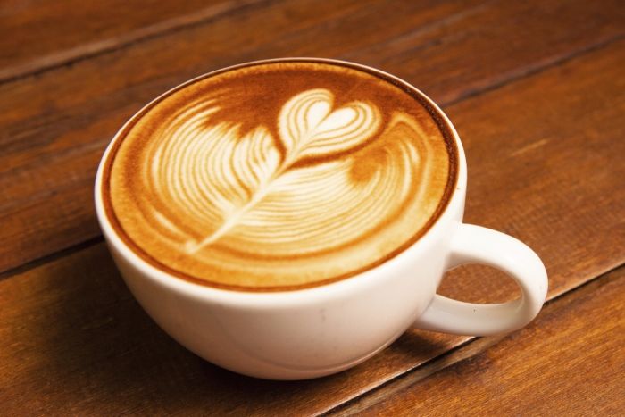 Person treating a coffee for Be an Angel Day