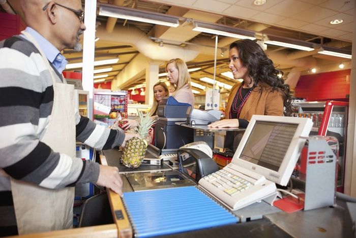 Customer letting someone ahead in line for Be an Angel Day