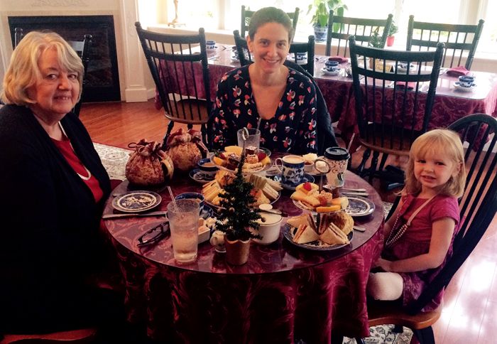 Series author Elizabeth Adams (center) enjoys afternoon tea with her mother and daughter.