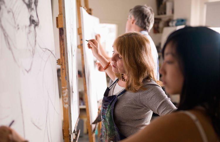 Woman taking a summer painting class