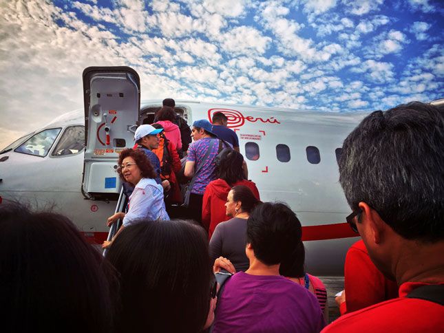 Katie and friends board the plane to Cusco