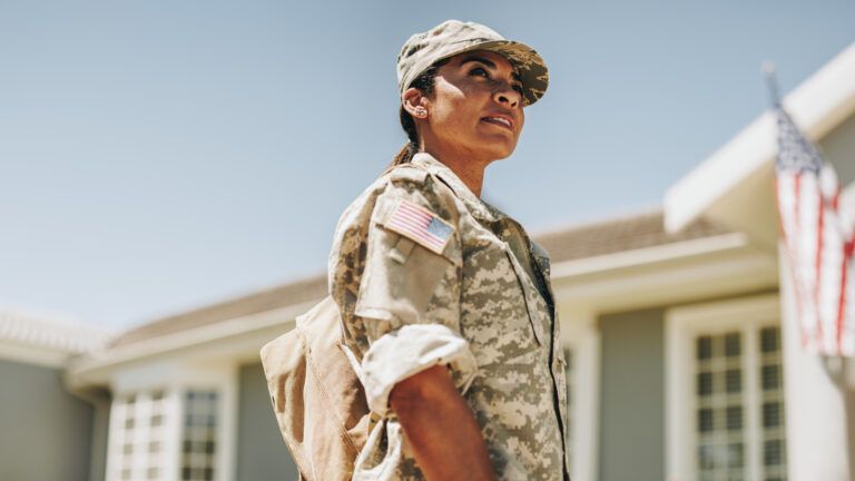 Woman soldier looking up and being inspired by veterans day quotes