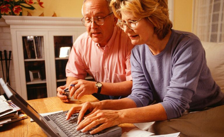 A mature couple goes over their finances together