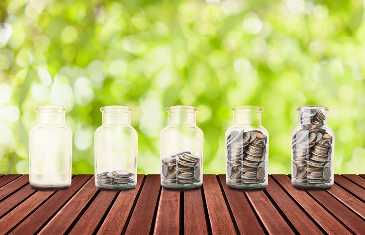 A collection of savings jars filled with coins