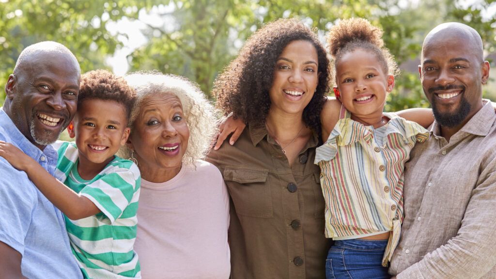 Smiling multi-generation family having a difficult conversation