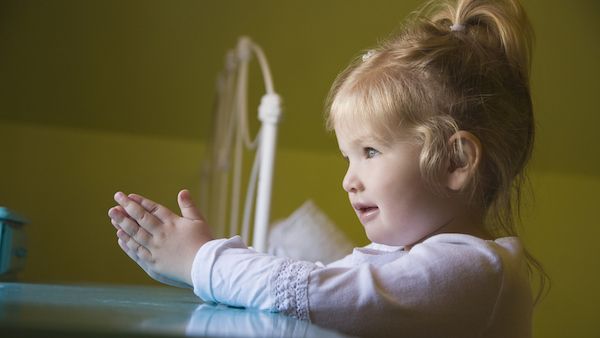 A granddaughter inspires a grandfather in prayer.