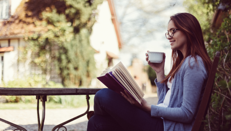 Woman reading Lent bible verses outside