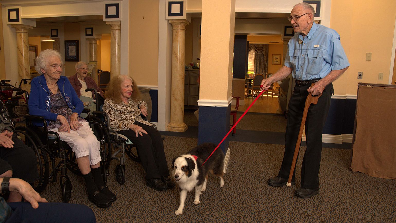 Roger and Jack greet some of the residents of Gulf Coast Village.