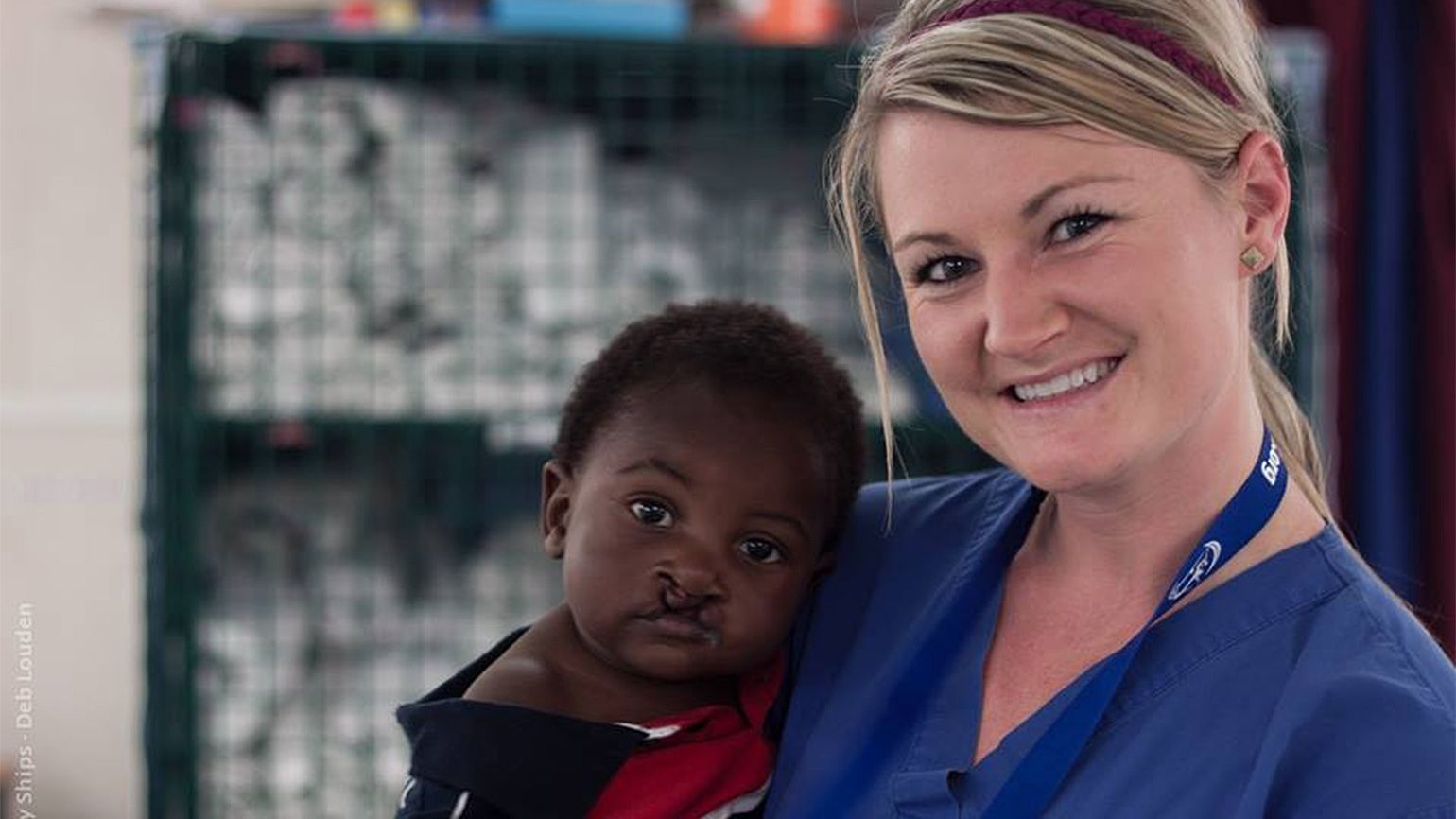 Heather poses with one of her young patients