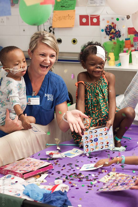 Heather enjoys a laugh with two of her young patients