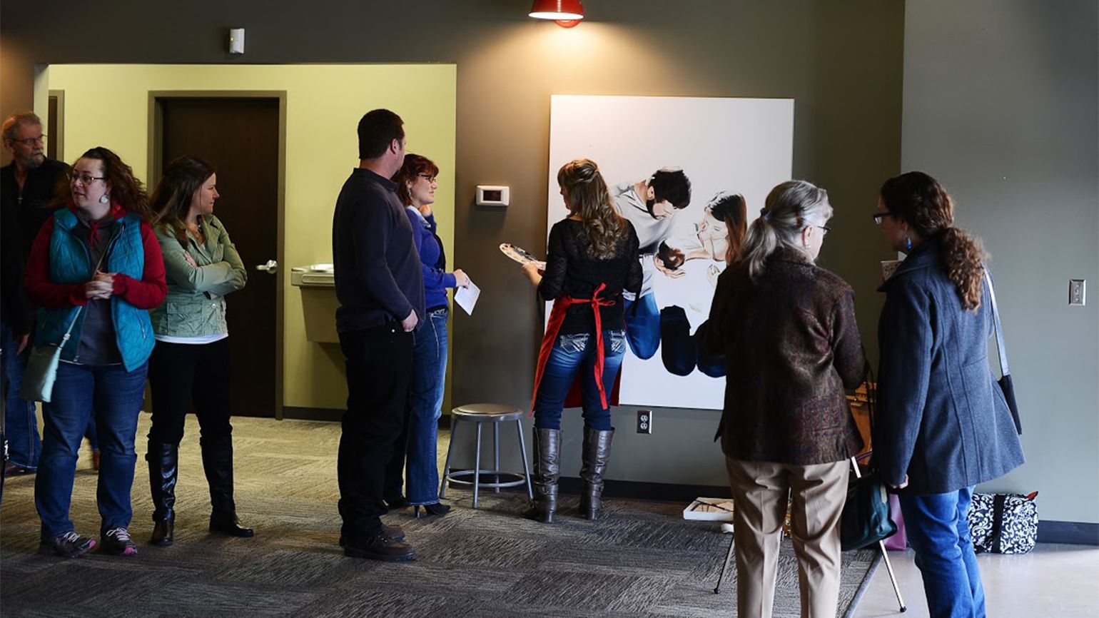 Church goers gather around to watch Jessie at work