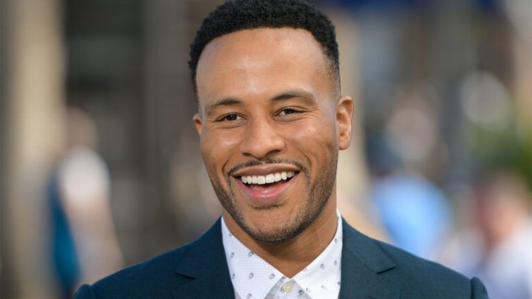 DeVon Franklin poses with Hollywood sign