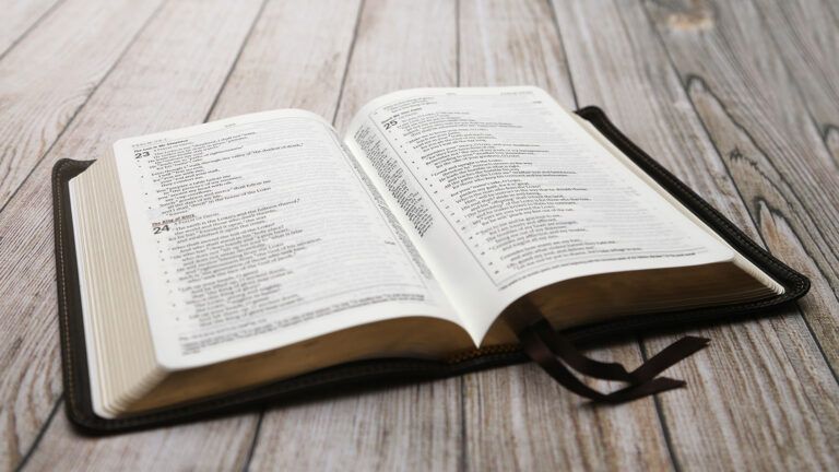 A Bible rests on a wooden table