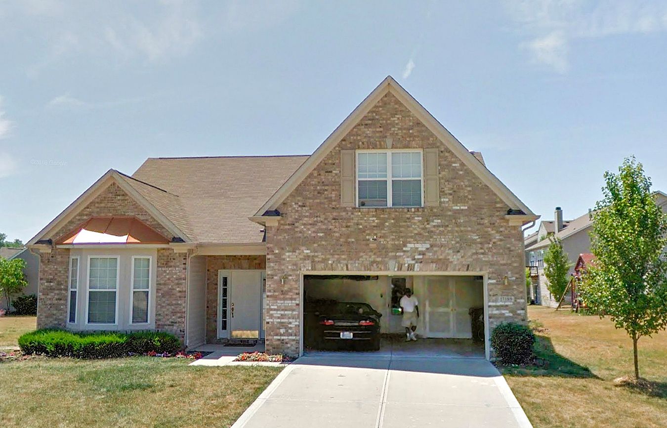 The home of Olga's late brother, with Bob visible in the garage