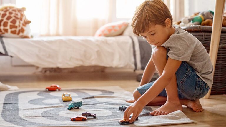 Grandson playing with toy cars.