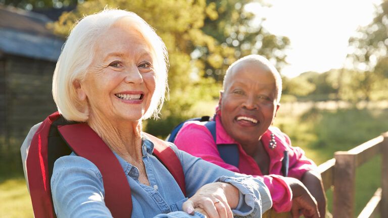 Two mature women celebrate their friendship