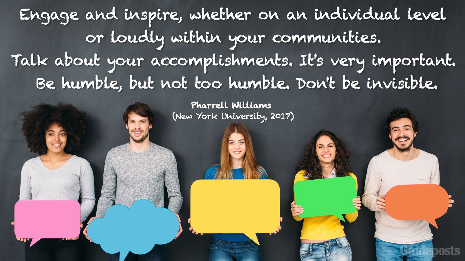 A group of diverse students in front of a chalkboard holding colorful communication bubbles.