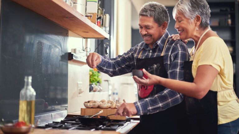 Married couple cooking together