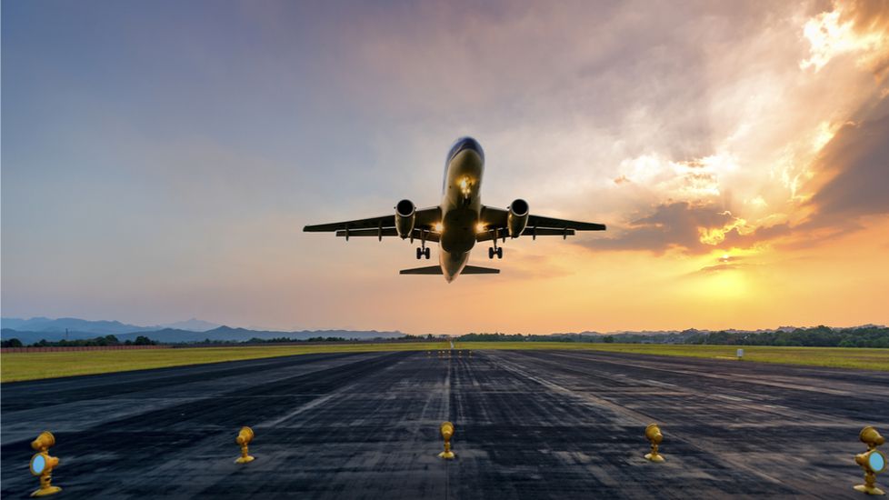 A plane taking off the runway with prayers for safe travel