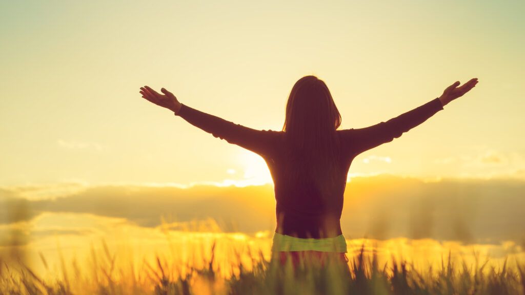 Woman feeling free in a beautiful natural setting.