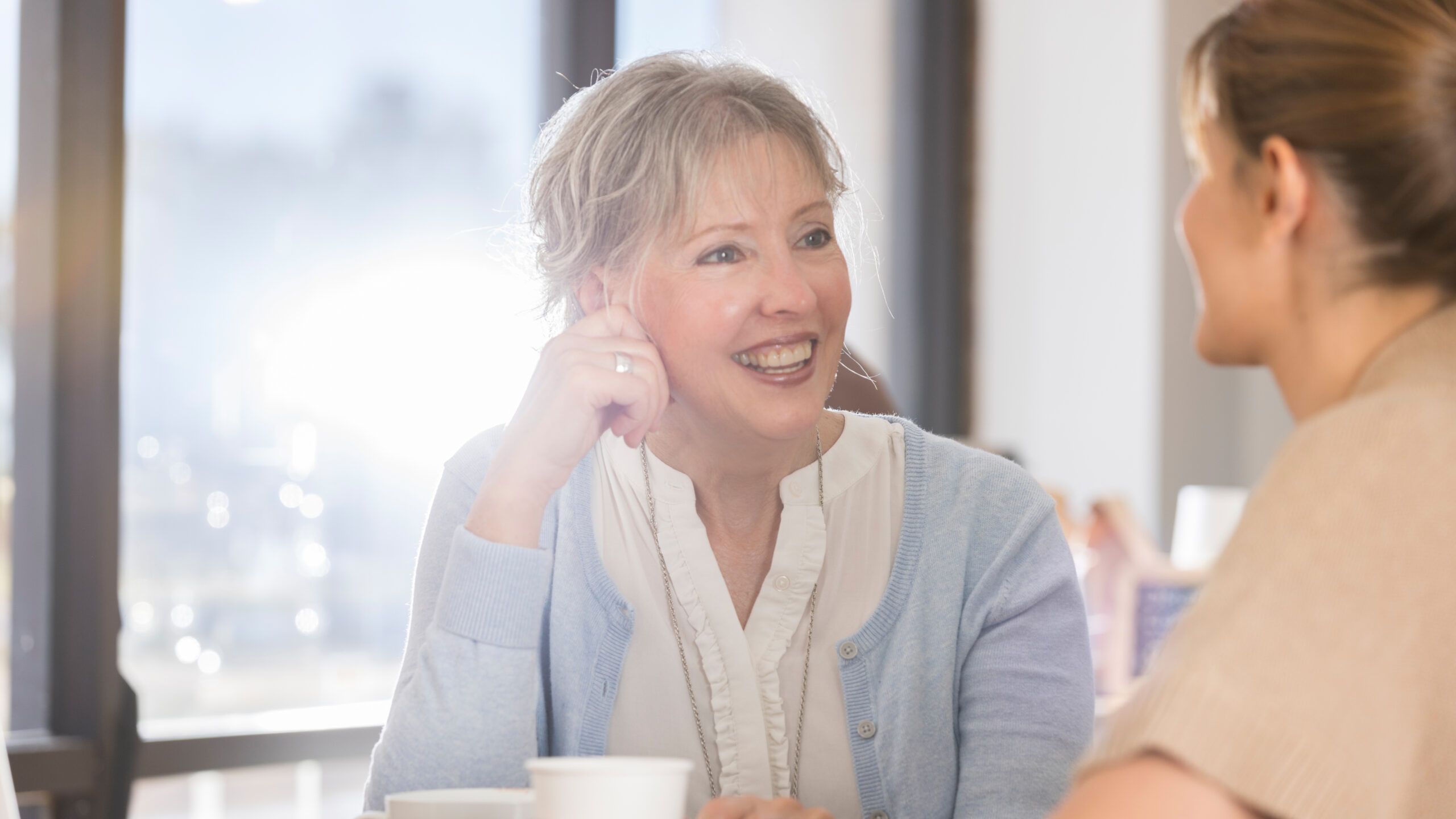 Women talking over coffee