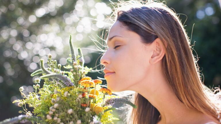 smelling_flowers